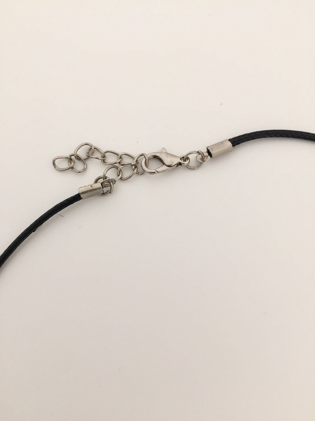 Clasp of black leather necklace