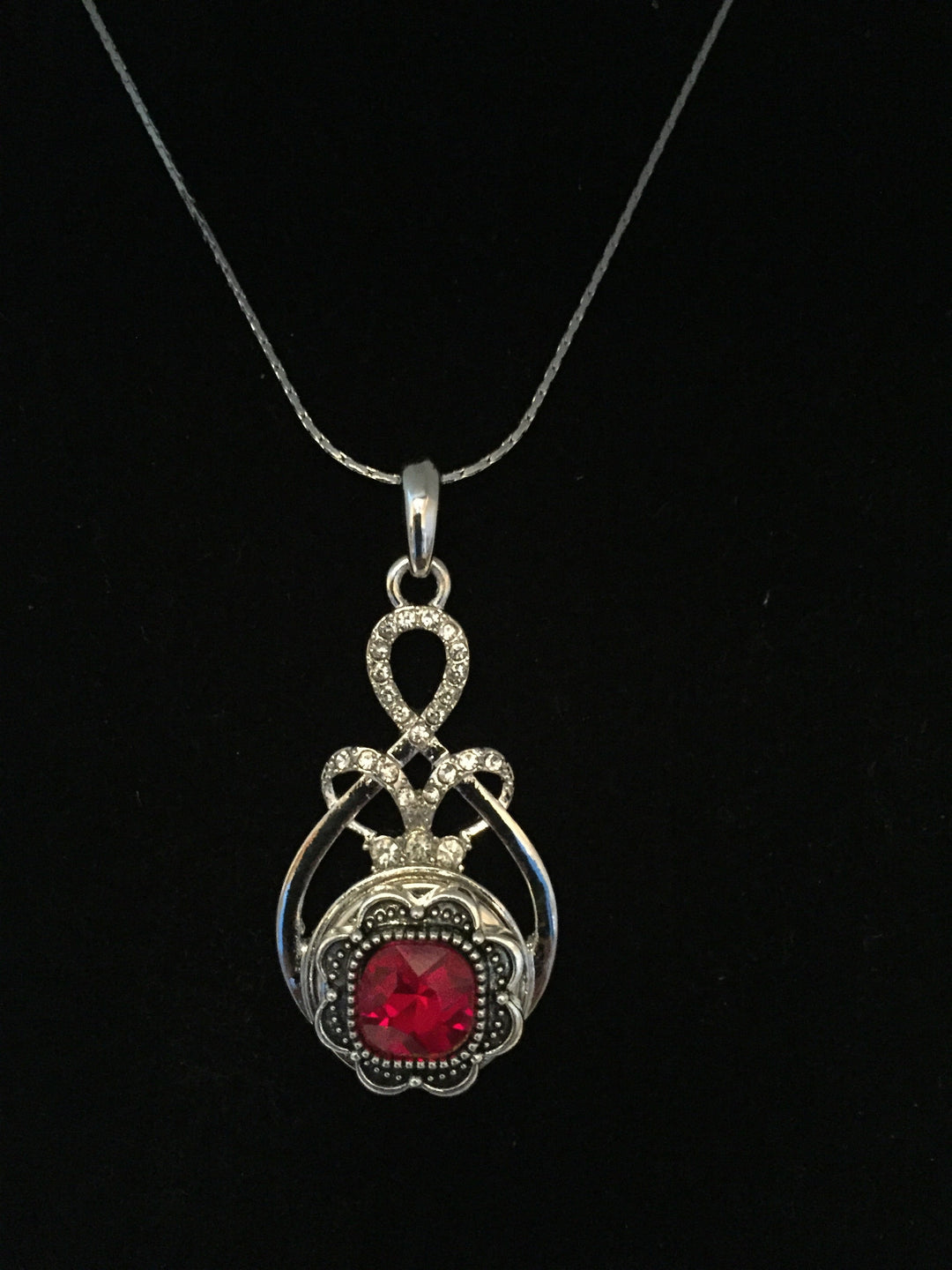 Love knot necklace with red gem snap